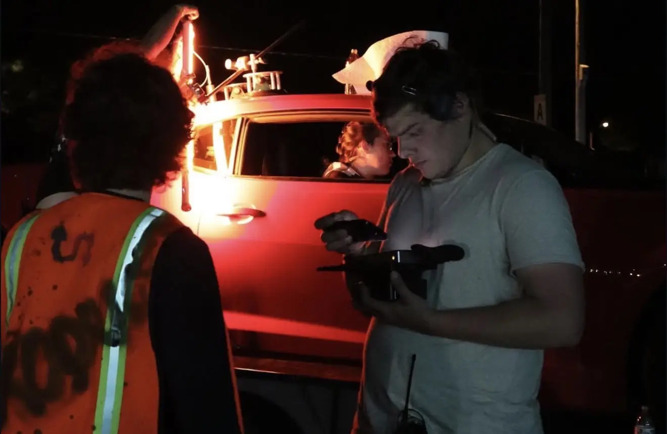 Matthew Nelson on camera during a night exterior
